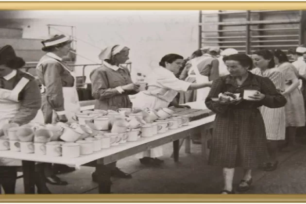 Picture: Kulturen Museum - KM 97009: Jewish women are being served meals in sport hall in Lund, 1945